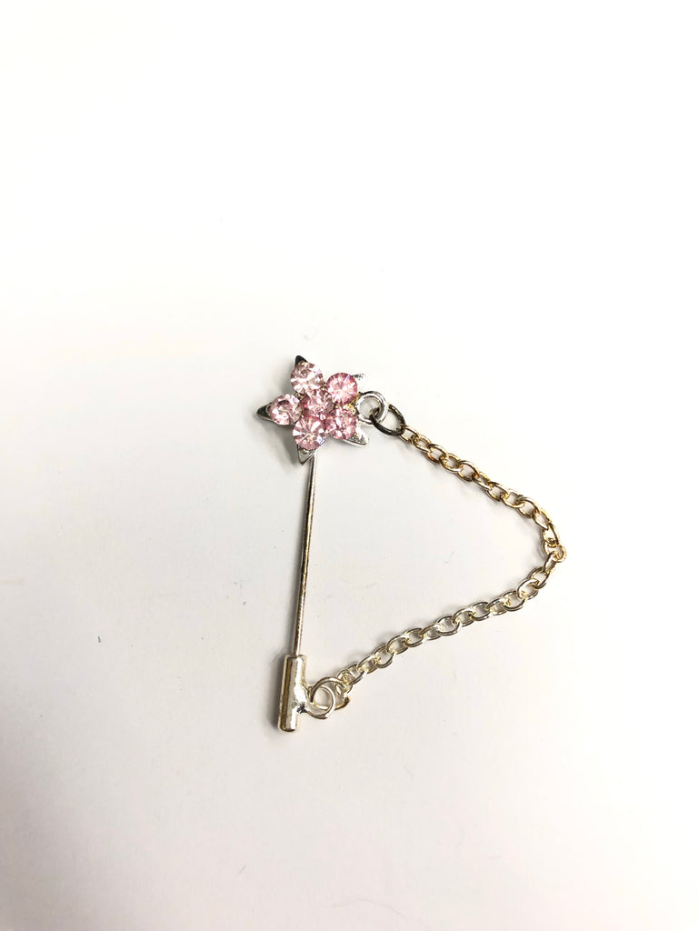 silver clasp pin with light pink star jewel and a chain