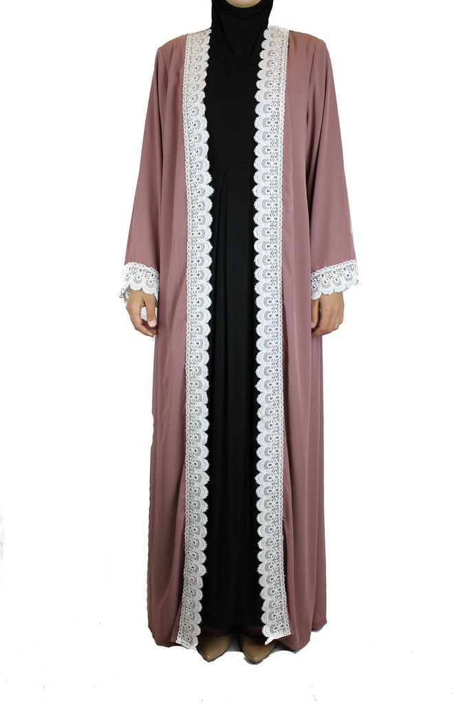 woman wearing an abaya in mauve embellished with white lace sleeves