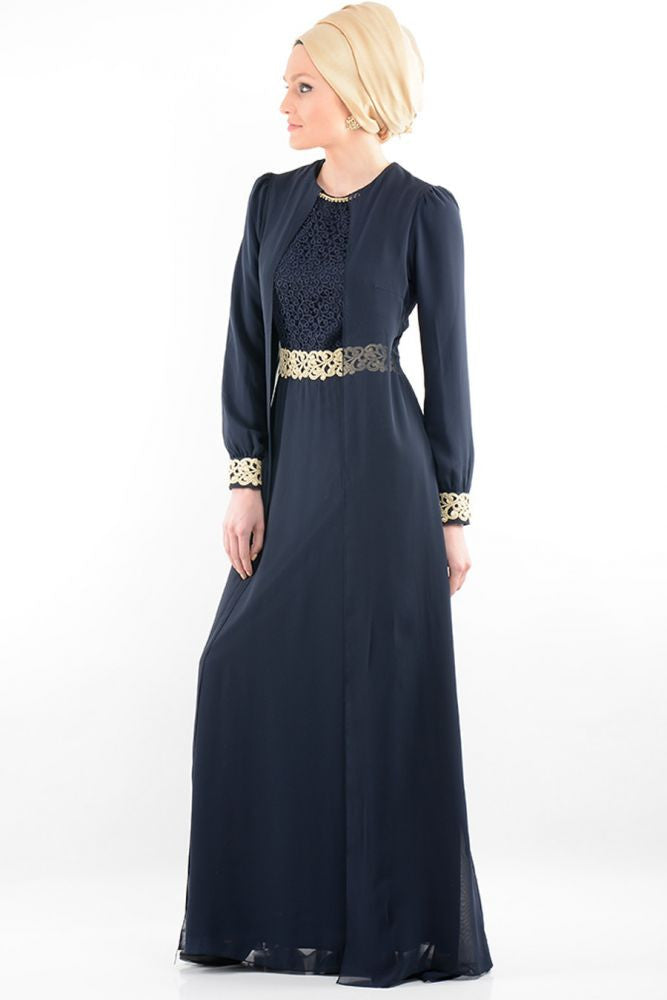 turkish woman wearing a gold hijab an elegant navy long sleeve maxi dress with gold embellishments