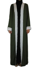 woman wearing an abaya in olive green embellished with white lace sleeves