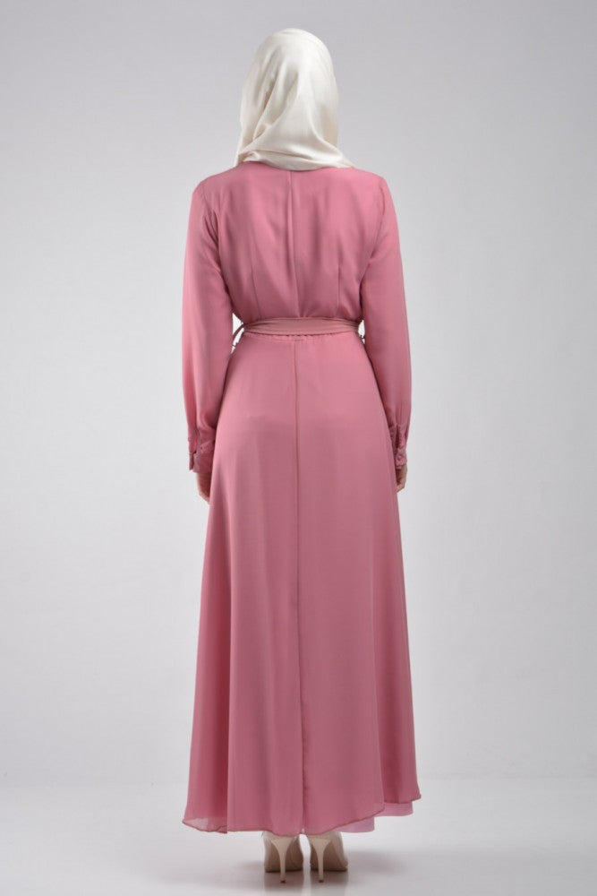 long sleeve maxi dress in pink with pockets and a waist tie