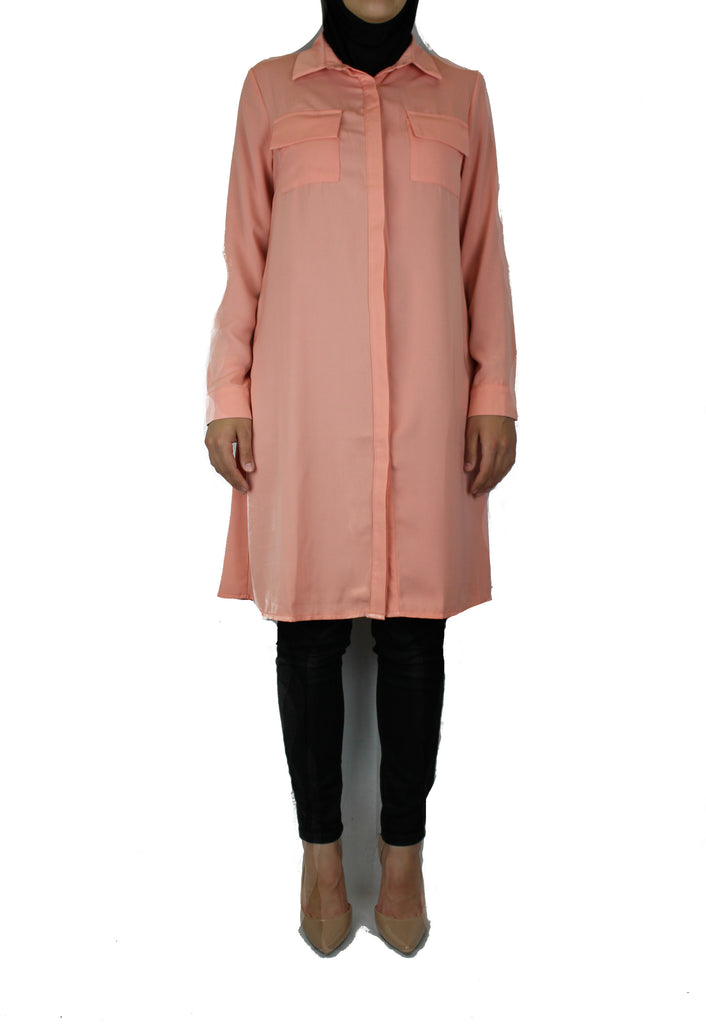 light pink modest long sleeved dress shirt with pockets and a collar