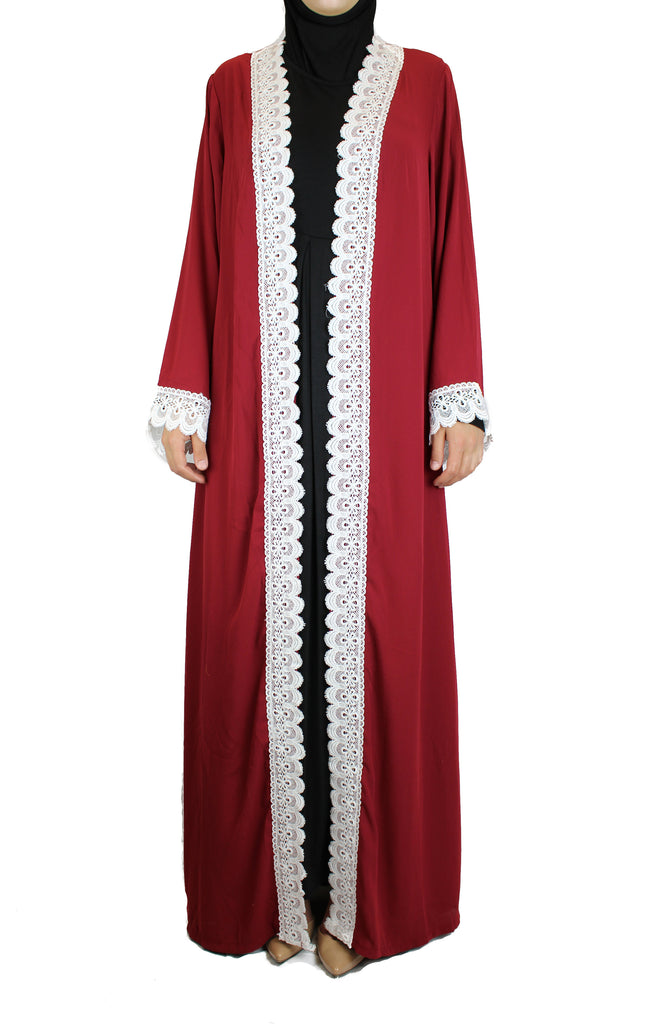 woman wearing an abaya in red embellished with white lace sleeves
