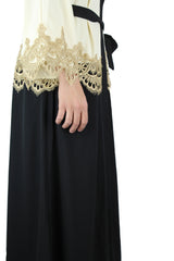 black and creme two toned abaya with gold trim and waist tie